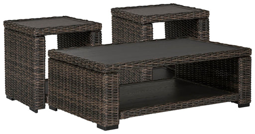 Outdoor Grasson Lane occasional table set by Ashley Furniture featuring a round table with a glass top and matching chairs.