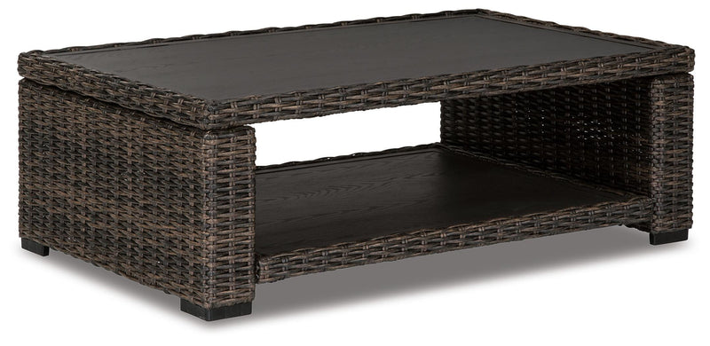 Outdoor cocktail table from Ashley Furniture's Grasson Lane collection, featuring a stylish design and sturdy construction.