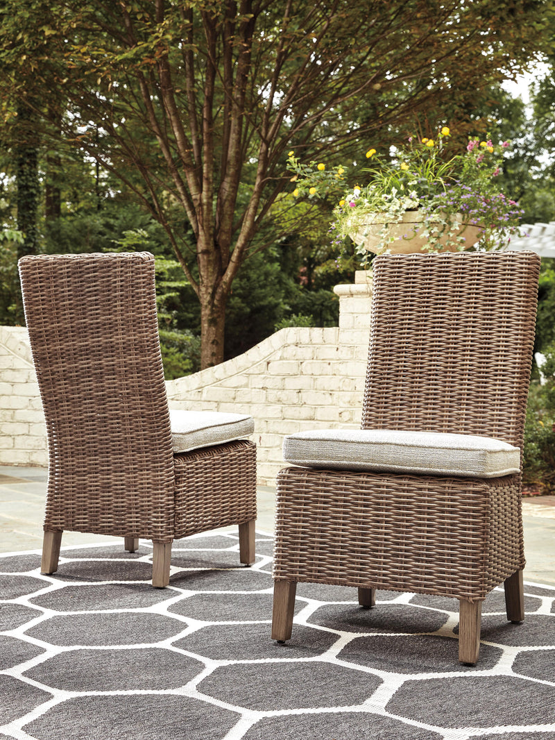 Ashley Furniture Beachcroft outdoor dining set with a table and chairs, ideal for patio or garden outdoor dining.