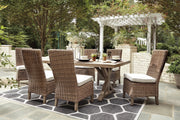 Ashley Furniture Beachcroft outdoor dining set with a round table and six chairs, perfect for outdoor gatherings.