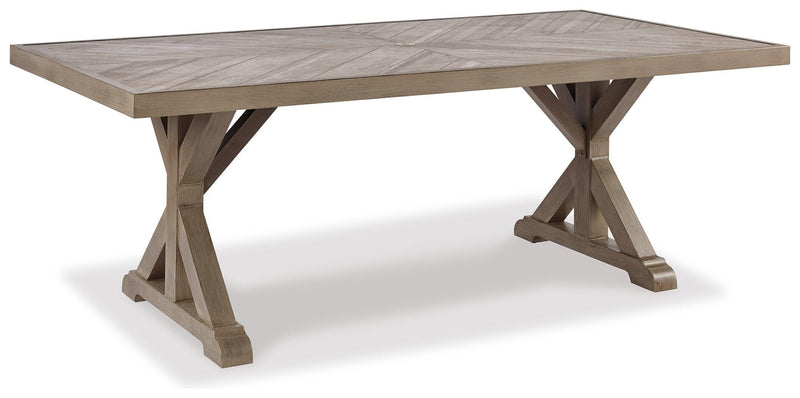 Ashley Furniture Beachcroft outdoor dining set with round table and six chairs, made of weather-resistant material.