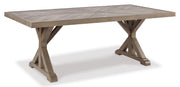 Ashley Furniture Beachcroft outdoor dining set with a table and six chairs, shown from an angled view.