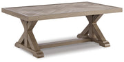 Angle view of Ashley Furniture Beachcroft outdoor seating set with cushioned chairs and table for patio relaxation.