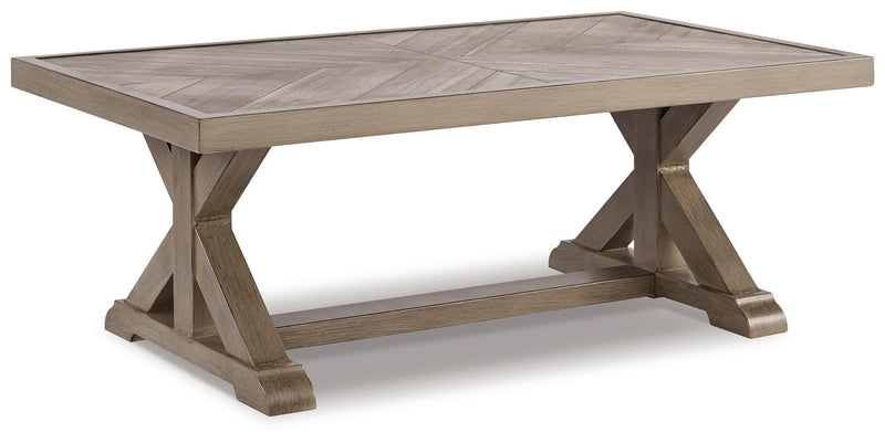 Angle view of Ashley Furniture Beachcroft outdoor seating set with cushioned chairs and table for patio relaxation.