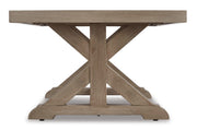 Ashley Furniture Beachcroft outdoor seating set with cushioned chairs and a matching table on a patio.
