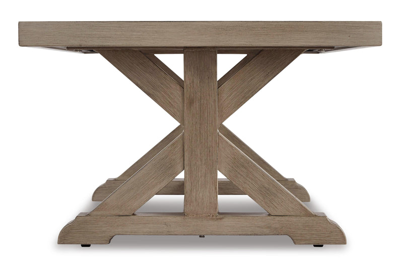 Ashley Furniture Beachcroft outdoor seating set with cushioned chairs and a matching table on a patio.