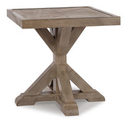 Ashley Furniture Beachcroft outdoor seating set with cushioned chairs and a matching table, arranged on a patio.