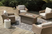 Outdoor Ashley Furniture Beachcroft fire pit table with four Nuvella swivel lounge chairs in a cozy backyard setting.