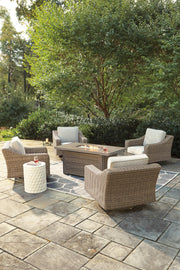 Outdoor seating set with Ashley Furniture Fire Pit Table and four Nuvella swivel lounge chairs on patio.