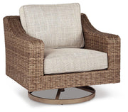 Outdoor Ashley Furniture Beachcroft outdoor seating set with cushioned chairs and a coffee table on a patio.