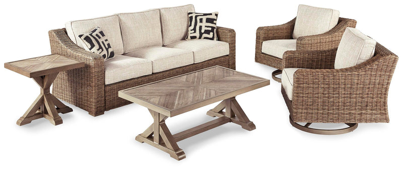 Outdoor Ashley Furniture Beachcroft outdoor conversation set with cushioned chairs and a matching table on a patio.