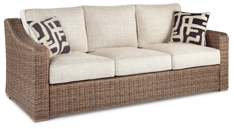 Ashley Furniture Beachcroft outdoor seating set with cushioned chairs and a table, ideal for patio or garden relaxation.