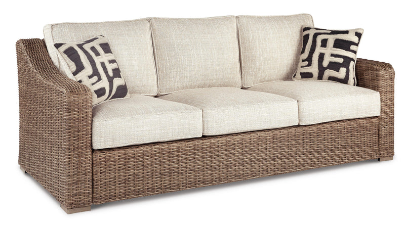 Ashley Furniture Beachcroft outdoor seating set with cushioned chairs and table, perfect for patio relaxation.
