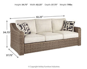 Ashley Furniture Beachcroft outdoor seating set with cushioned chairs and a round table, perfect for patio relaxation.