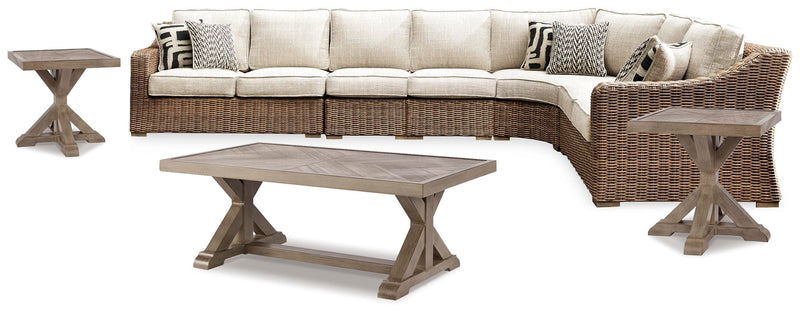 Ashley Furniture Beachcroft outdoor seating set with cushioned chairs and table, ideal for patio or garden relaxation.