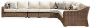 Ashley Furniture Beachcroft outdoor seating set with cushioned chairs and a matching table, perfect for patio relaxation.