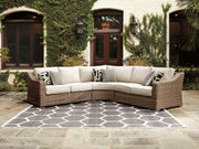 Ashley Furniture Beachcroft outdoor seating set with cushioned chairs and a matching table, ideal for patio relaxation.