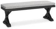 Ashley Furniture Beachcroft outdoor dining bench with cushion, showing a sturdy wooden frame and comfortable seating for outdoor use.