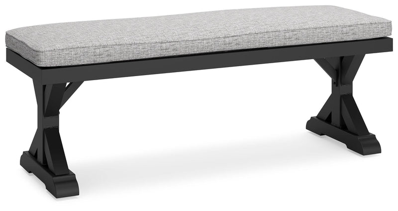 Ashley Furniture Beachcroft outdoor dining bench with cushion, showing a sturdy wooden frame and comfortable seating for outdoor use.