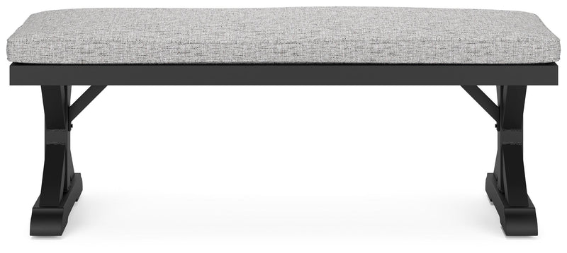 Ashley Furniture Beachcroft outdoor dining bench with cushion, featuring sturdy wood construction and comfortable seating for outdoor use.