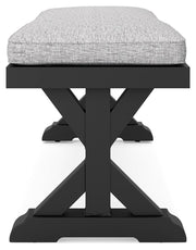 Ashley Furniture Beachcroft outdoor dining bench with cushion, sturdy wooden design, and comfortable seating for outdoor spaces.