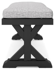 Ashley Furniture Beachcroft outdoor dining bench with cushion, featuring a sturdy wooden frame and comfortable seat for outdoor seating.