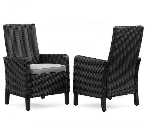 Set of two Ashley Furniture Beachcroft outdoor arm chairs with cushions, featuring stylish design and sturdy construction.