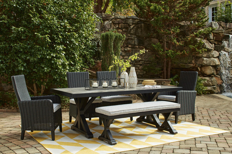 Ashley Furniture Beachcroft outdoor dining bench with cushion, featuring a sturdy wooden frame and comfortable seating for outdoor spaces.