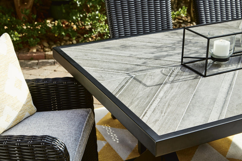 Ashley Furniture Beachcroft outdoor dining table with a slatted wooden top and sturdy metal legs for outdoor use.