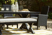 Ashley Furniture Beachcroft outdoor dining table with a wooden top and metal frame for patio or backyard dining.