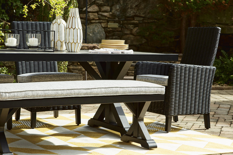 Ashley Furniture Beachcroft outdoor dining table with a wooden top and metal frame for patio or backyard dining.