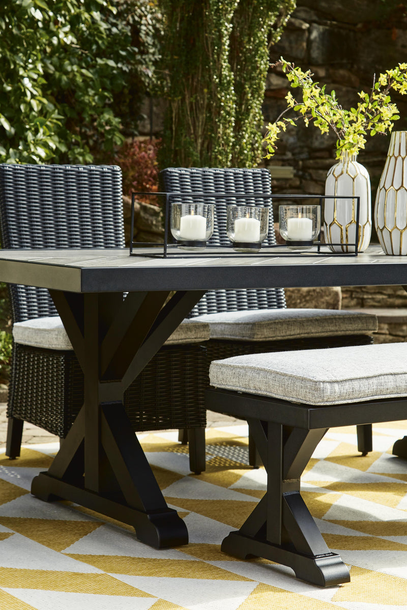Beachcroft outdoor dining table by Ashley Furniture with a wooden tabletop and sturdy metal legs for outdoor gatherings.
