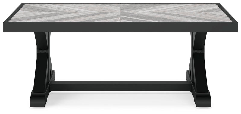 Outdoor Ashley Furniture Beachcroft outdoor cocktail coffee table with a slatted top and sturdy frame, ideal for patio lounging.