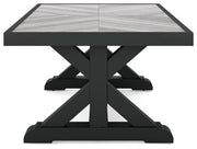 Ashley Furniture Beachcroft outdoor cocktail table with a wooden slat top and metal frame, perfect for patio or garden seating areas.