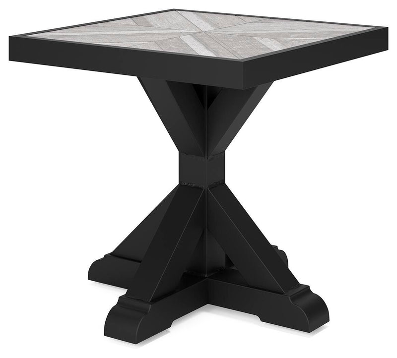 Ashley Furniture Beachcroft outdoor end table shown from an angle, featuring a sturdy wooden design suitable for patio or garden use.