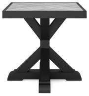 Ashley Furniture Beachcroft outdoor end table with a woven rattan-style top and black metal frame, suitable for patio or garden use.