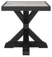 Beachcroft outdoor end table by Ashley Furniture with a black metal frame and wooden top, perfect for patio or garden seating areas.