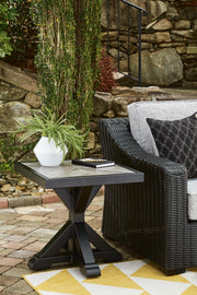 Outdoor end table from Ashley Furniture's Beachcroft collection, featuring a stylish design suitable for outdoor patio spaces.