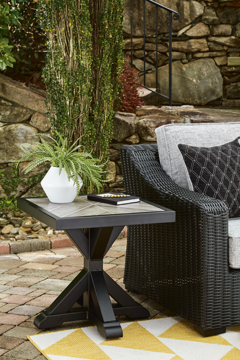 Outdoor end table from Ashley Furniture's Beachcroft collection, featuring a stylish design suitable for outdoor patio spaces.