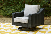 Ashley Furniture Beachcroft outdoor swivel lounge chair with cushion, featuring a woven design and a comfortable seating area.