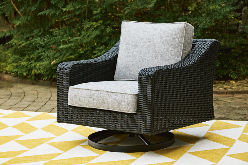 Ashley Furniture Beachcroft outdoor swivel lounge chair with cushion, featuring a woven design and a comfortable seating area.