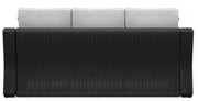 Ashley Furniture Beachcroft outdoor sofa with cushion, showing weather-resistant frame and plush seating for outdoor relaxation.