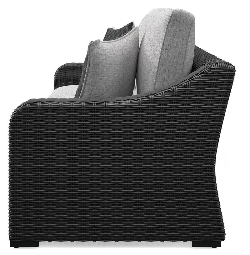 Ashley Furniture Beachcroft outdoor sofa with cushion, featuring a stylish design and comfortable seating for outdoor spaces.
