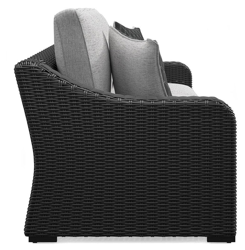 Ashley Furniture Beachcroft outdoor sofa with cushion, stylish outdoor seating for patio or garden relaxation.