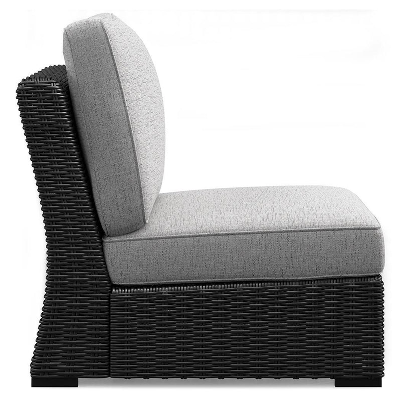 Outdoor sectional by Ashley Furniture with beige cushions and wicker frame, designed for outdoor lounging and entertaining.