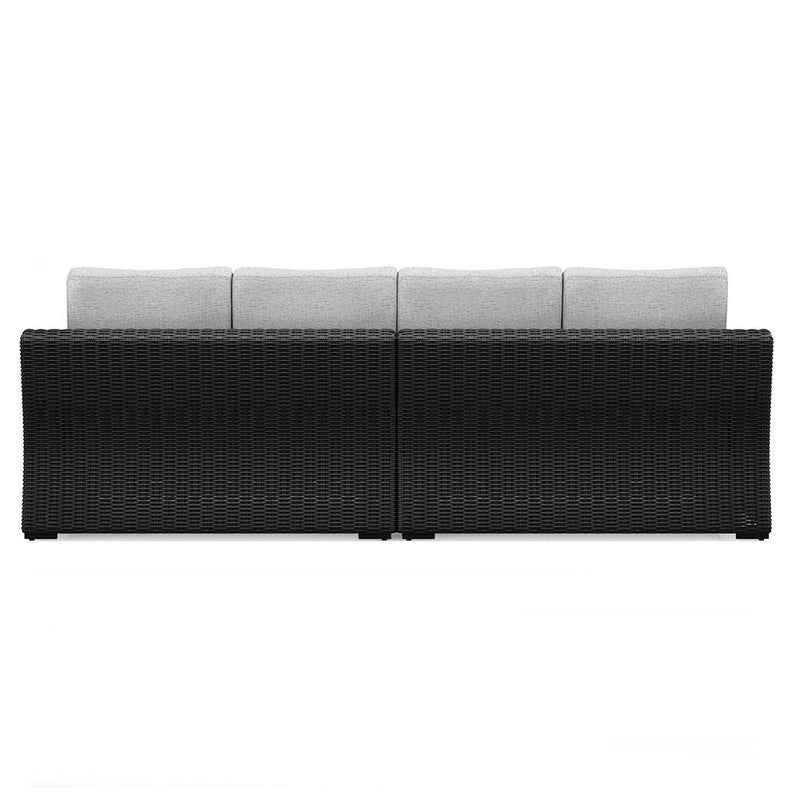 Outdoor sectional loveseat by Ashley Furniture with beige cushions, featuring two connected seats and a modern outdoor design.