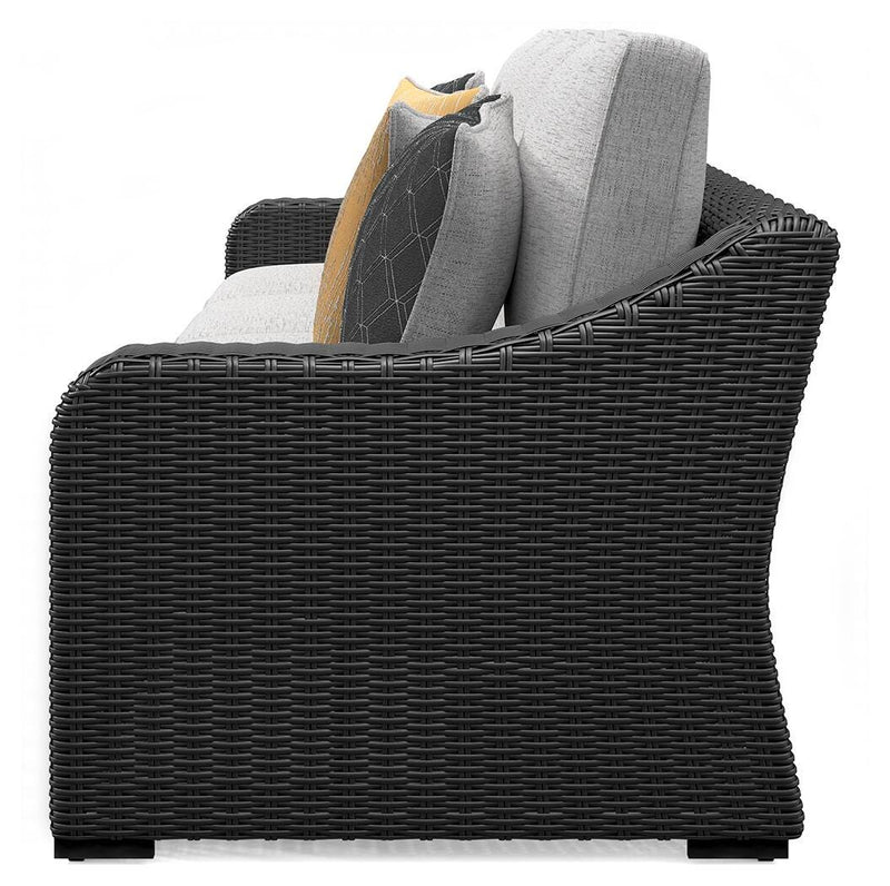 Outdoor sectional loveseat with cushions from Ashley Furniture, featuring beige fabric and a modern design for patio relaxation.