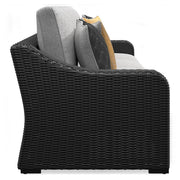 Outdoor sectional loveseat with cushions from Ashley Furniture's Beachcroft collection, featuring a stylish 2-piece design and comfortable seating.