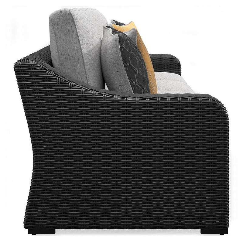 Outdoor sectional loveseat with cushions from Ashley Furniture's Beachcroft collection, featuring a stylish 2-piece design and comfortable seating.