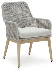 Ashley Furniture Seton Creek outdoor seating set with cushioned chairs and table, designed for patio or garden relaxation.